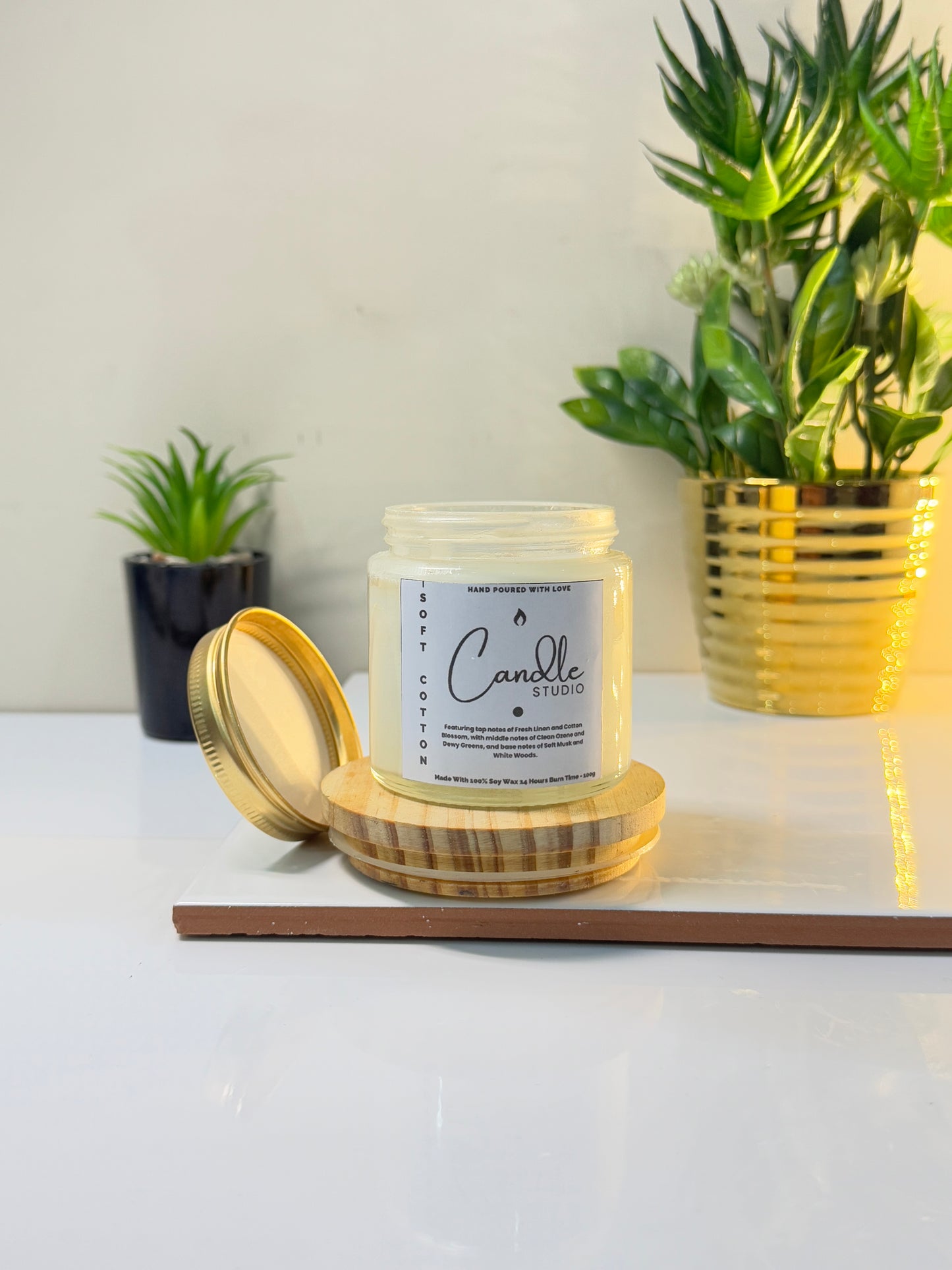Close-up of the Soft Cotton candle jar, highlighting the smooth finish and clean wax.