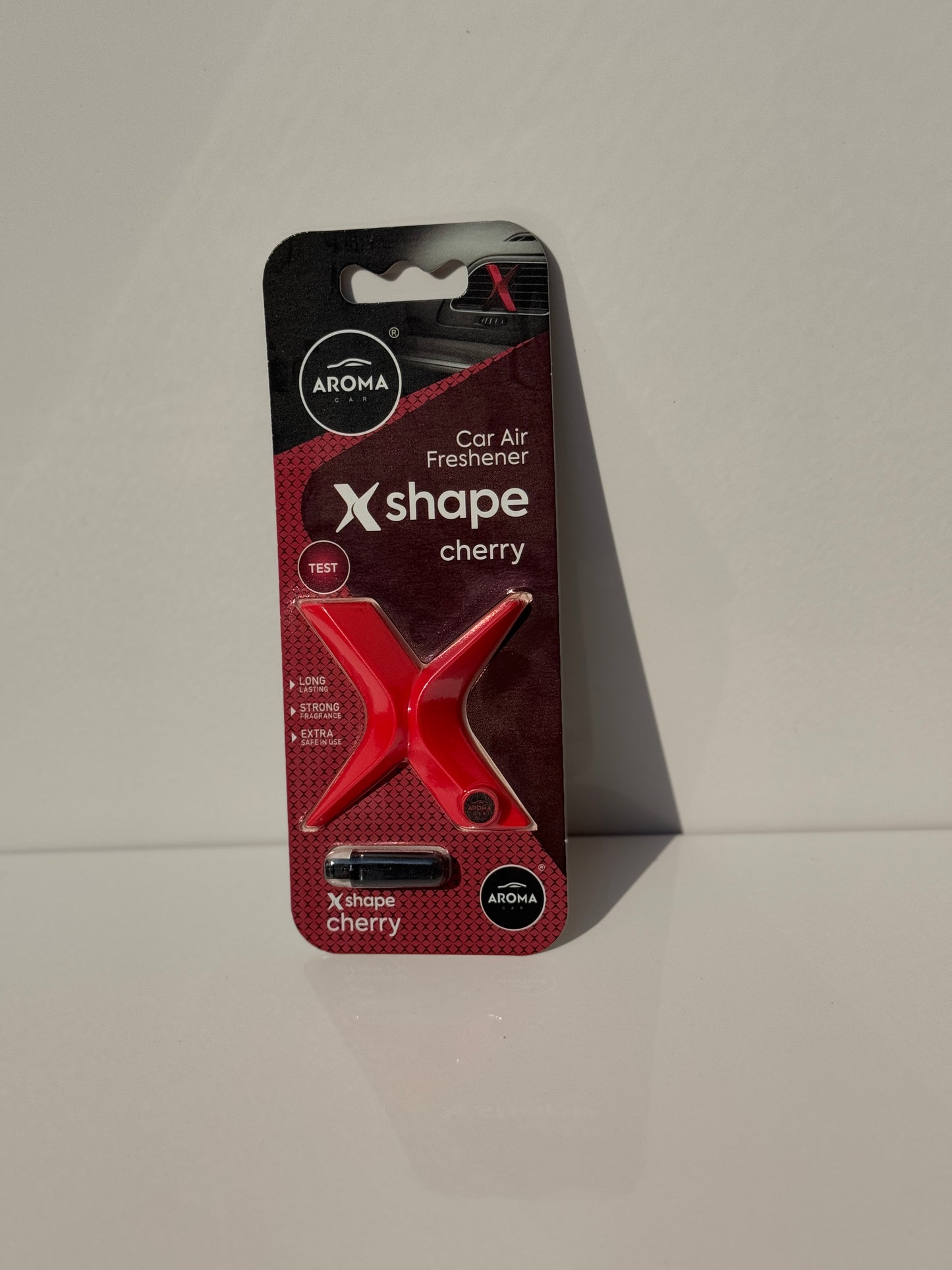 Driver's view of the Aroma Car X-Shape Air Fragrance blending with a car's interior design.