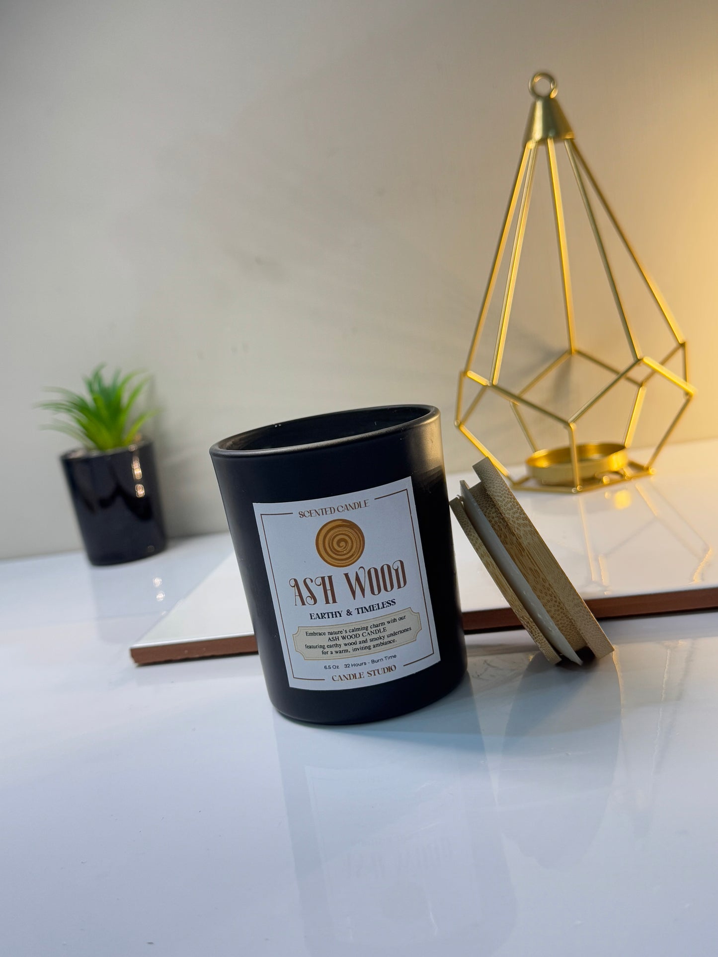 Elegant Ash Wood candle in a minimalist jar, showcasing its natural design and sophisticated finish.