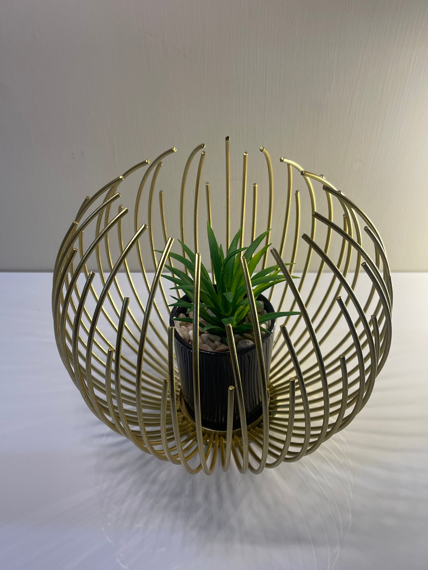 Metallic golden globe planter in medium size with an inner planter.