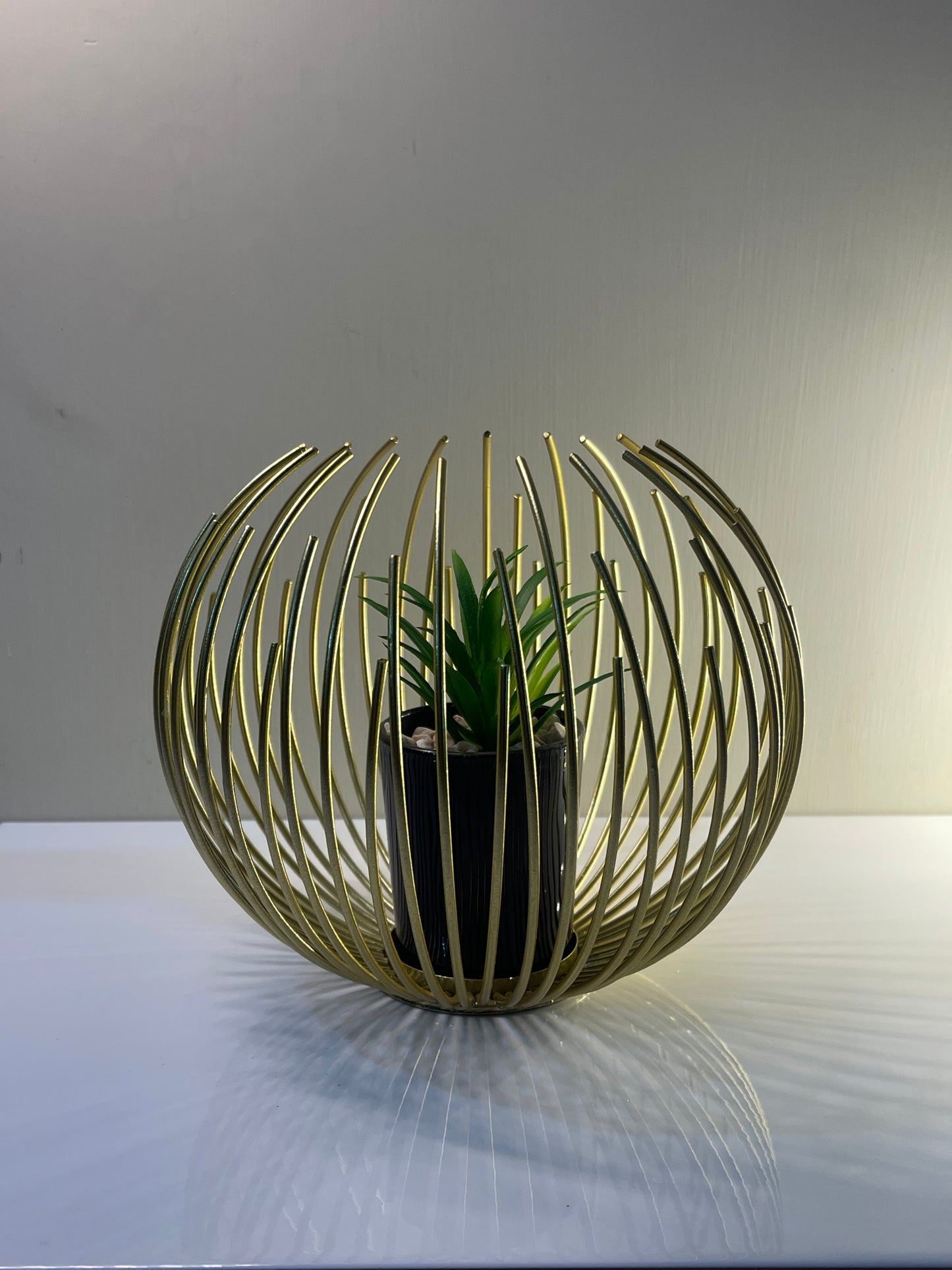 Metallic golden globe planter with inner planter.