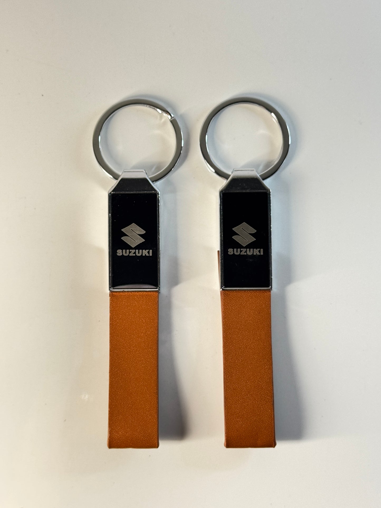 Premium Leather Suzuki Car Keychain – Durable Metal & Sleek Design – Tech Car Home Pakistan