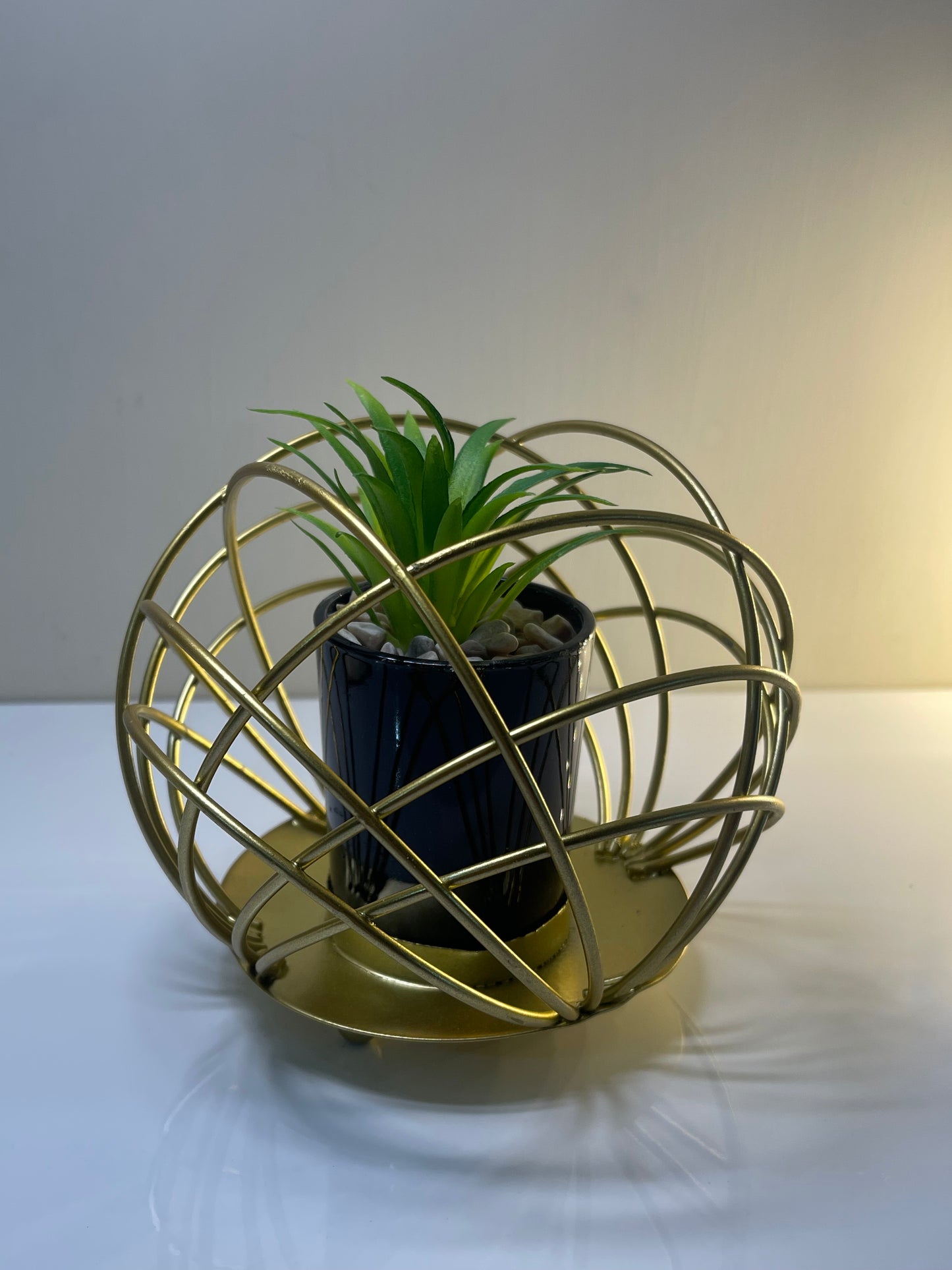 Side view of the iron cactus pot stand, perfect for home or office decor.