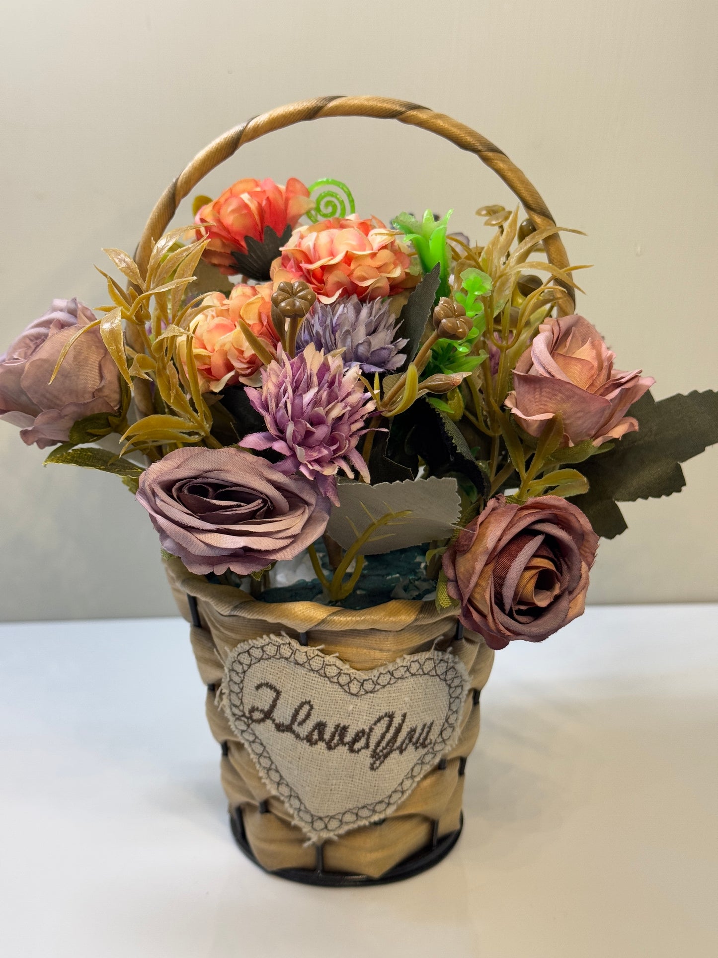 Side view of the mini flower basket with a small round design, perfect for smaller spaces.