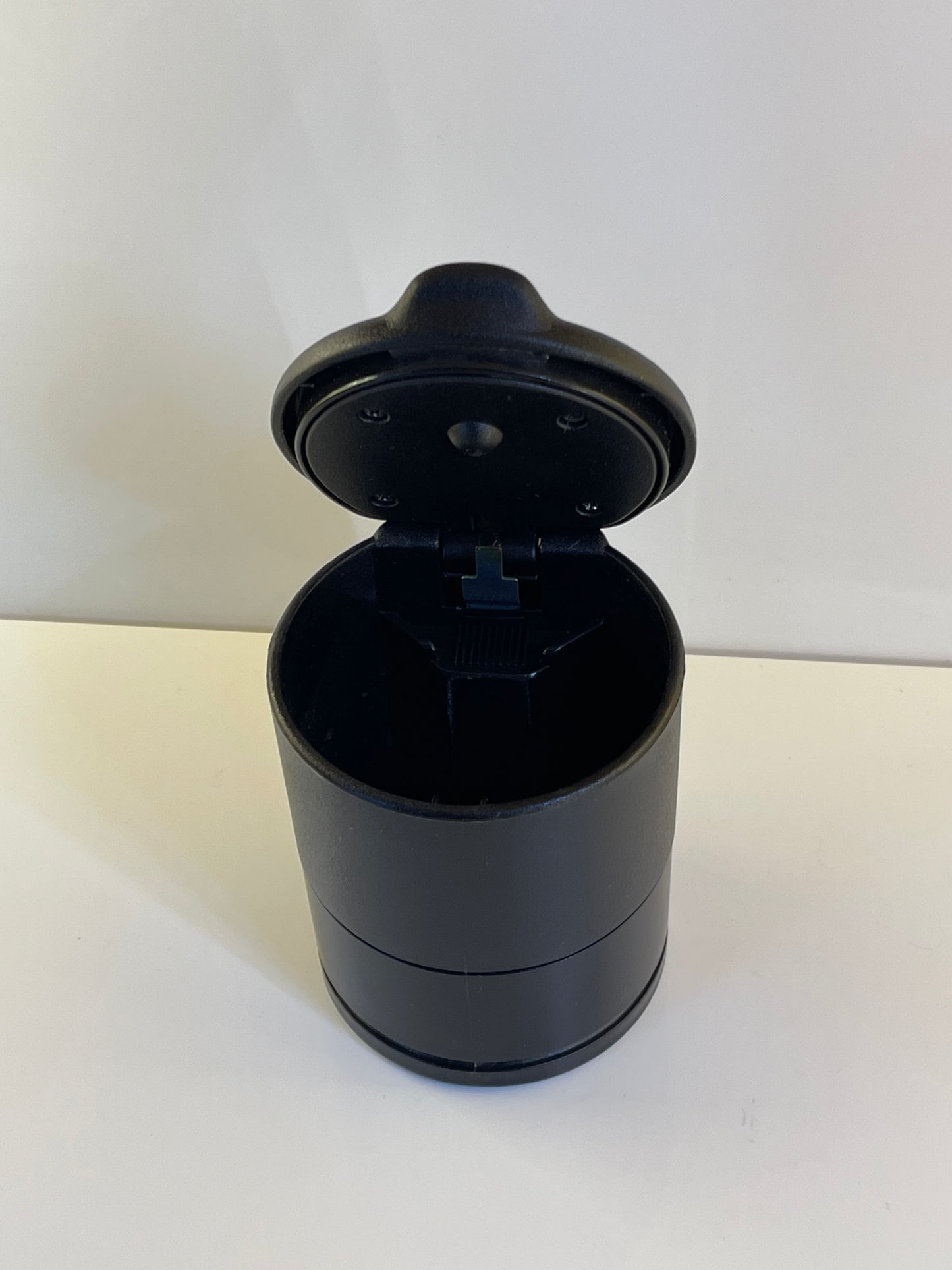 Sleek black ashtray cup with easy-to-clean removable liner – by TechCarHome.com.