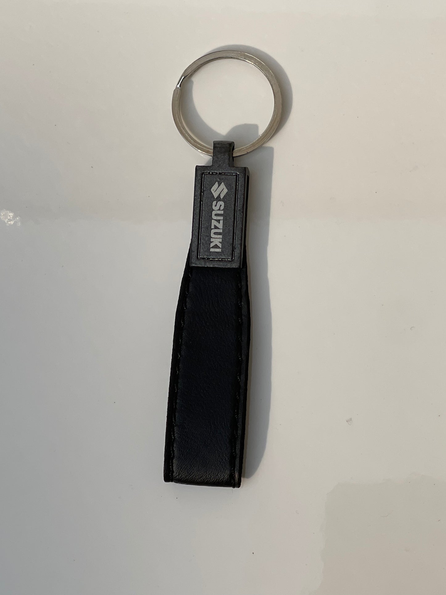 image of keychain with logo on suzuki premium quality in black color by techcarhome