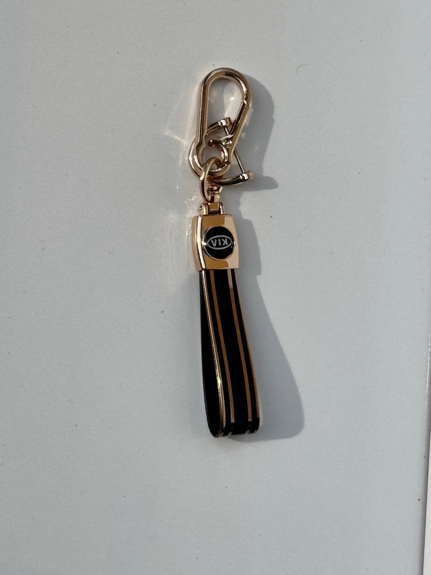 image of KIA logo car keychain premium quality in golden color