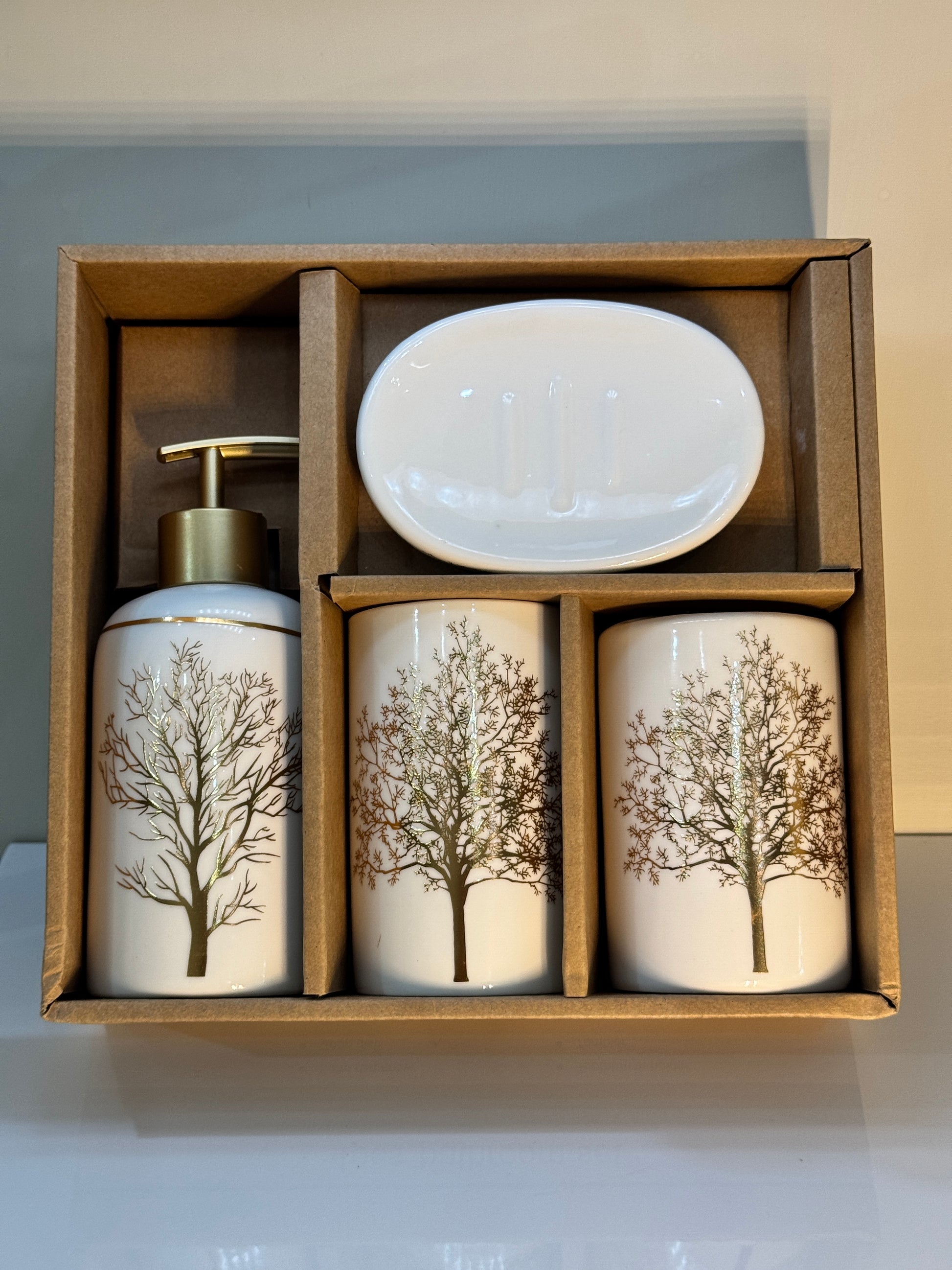 4-piece white and gold ceramic bathroom set securely packaged in a sturdy box, showcasing the round and elegant design.