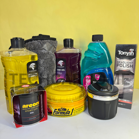 8-piece car care and scent bundle laid out against a mustard yellow backdrop.
