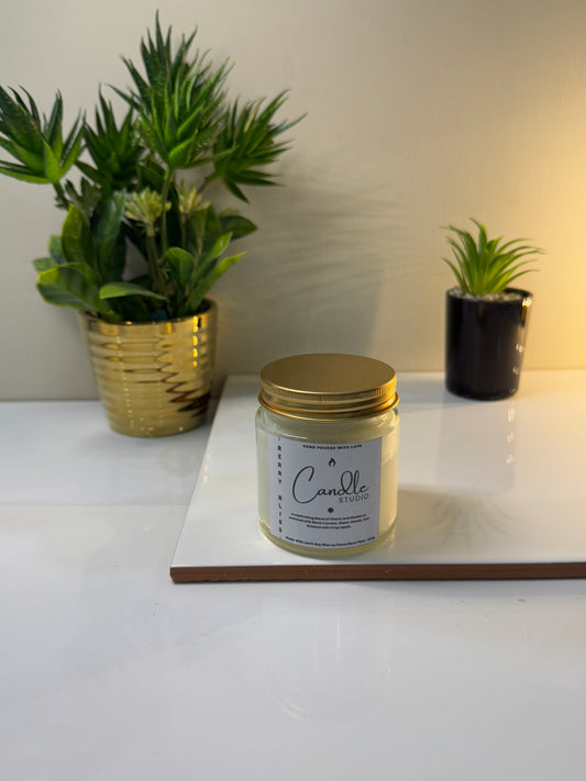 Berry Bliss candle in its sleek jar, unlit and showcasing its vibrant, fruity-inspired design.
