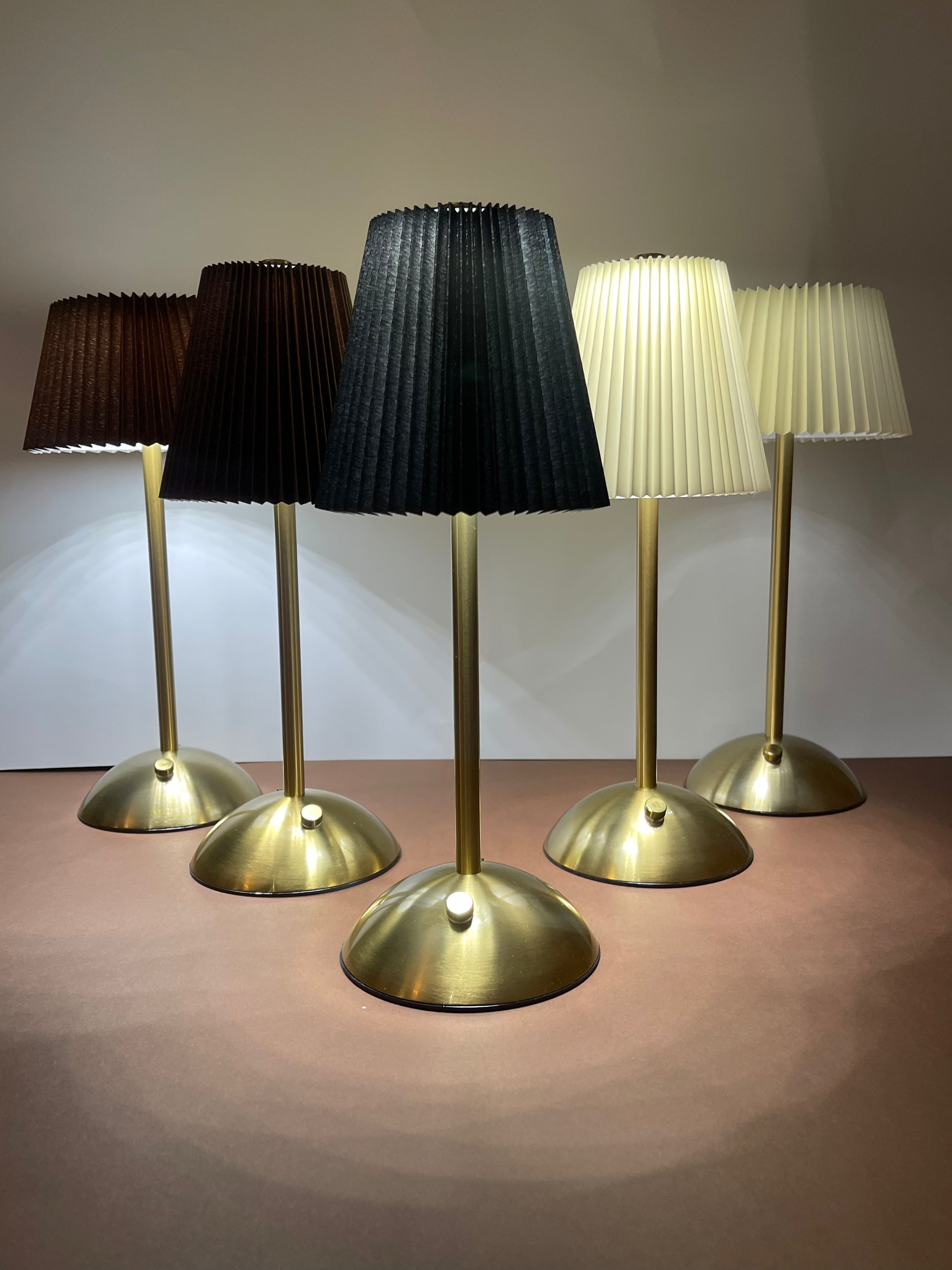 Black Shade Lamp: A sophisticated table lamp featuring a striking black shade, perfect for contemporary spaces and adding a bold statement.
