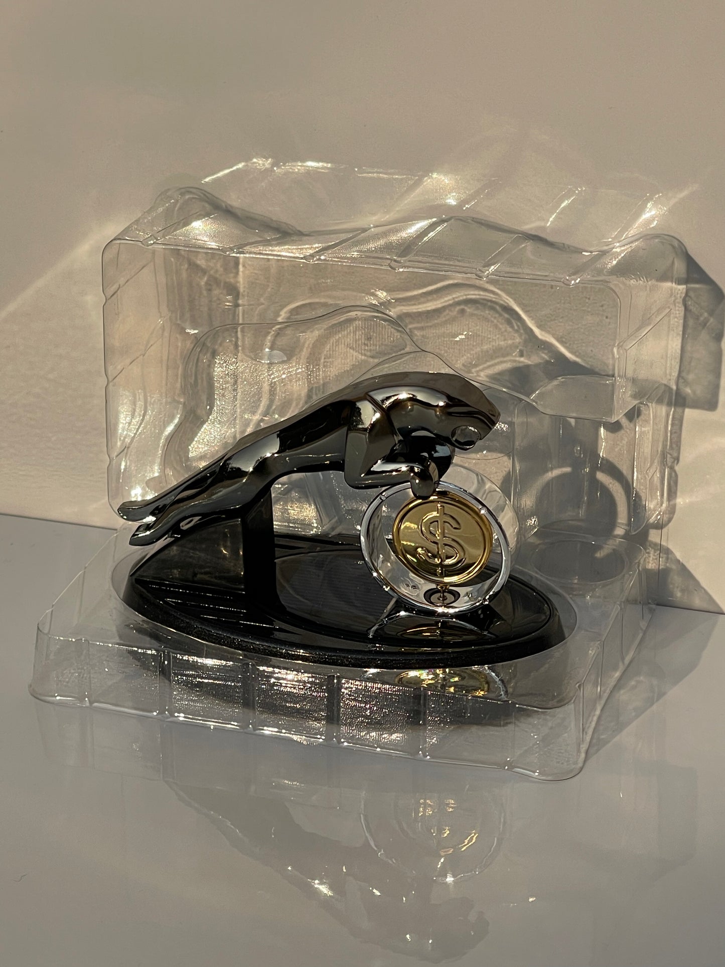 Close-up of Solar Powered Jaguar Car Perfume Rotating