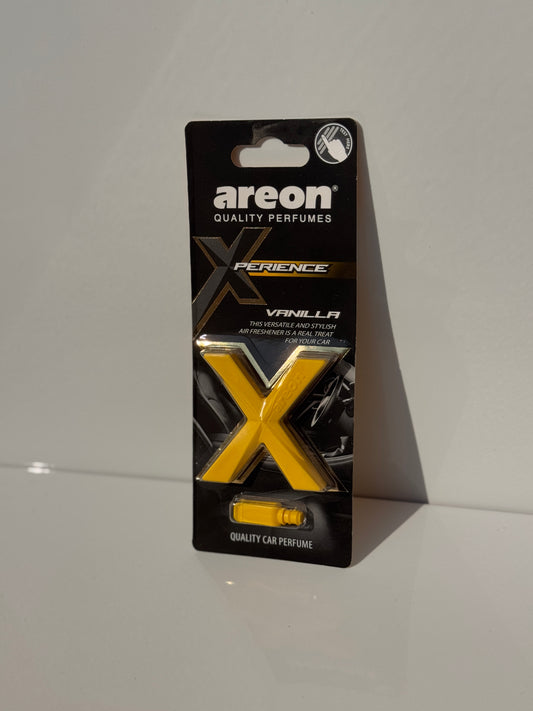 Close-up of 'Vanilla Delight' flavor packaging for AREON X-perience Car Air Freshener.