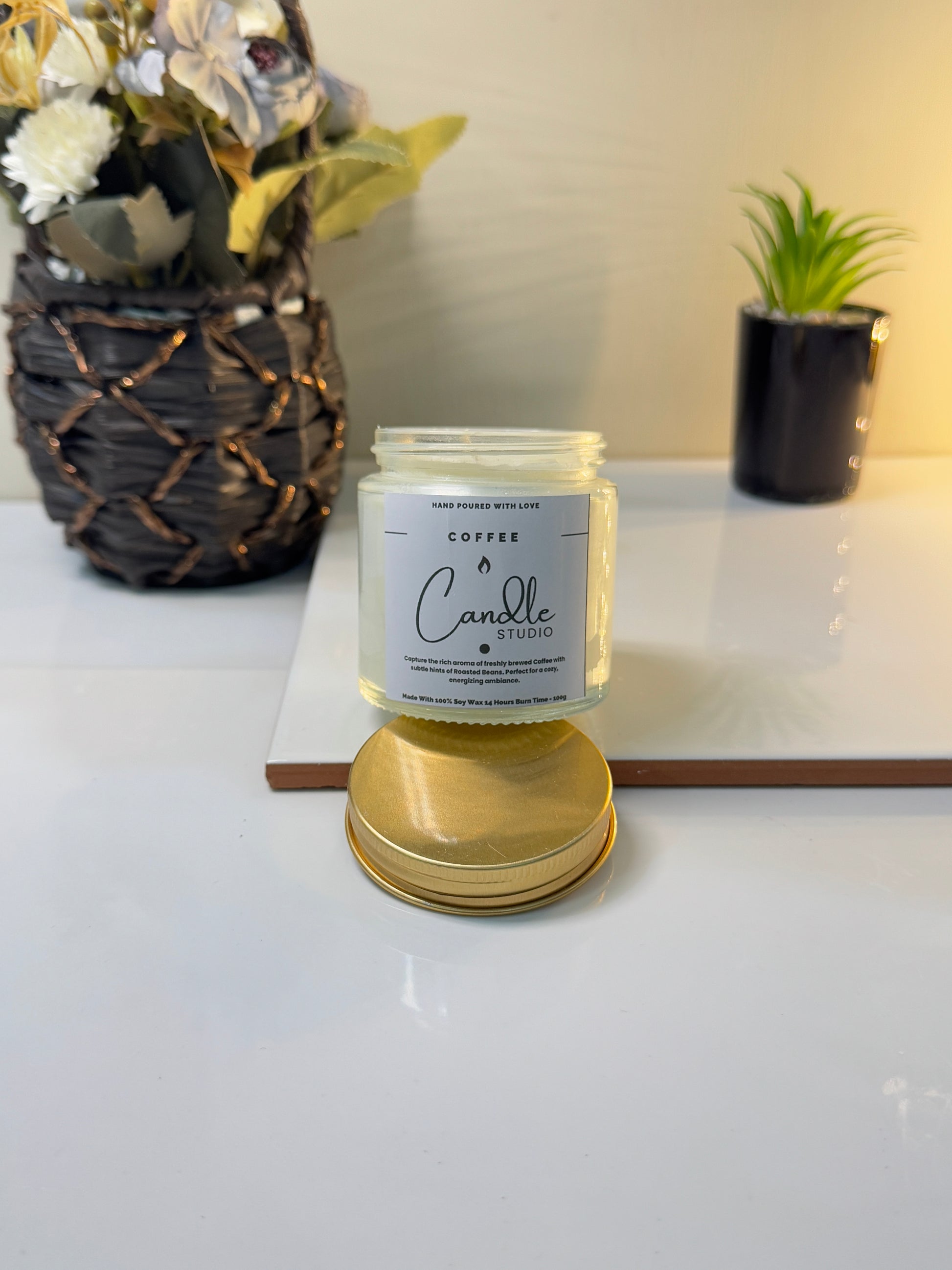 Close-up of the Coffee candle jar, highlighting its smooth finish and bold, roasted scent theme.