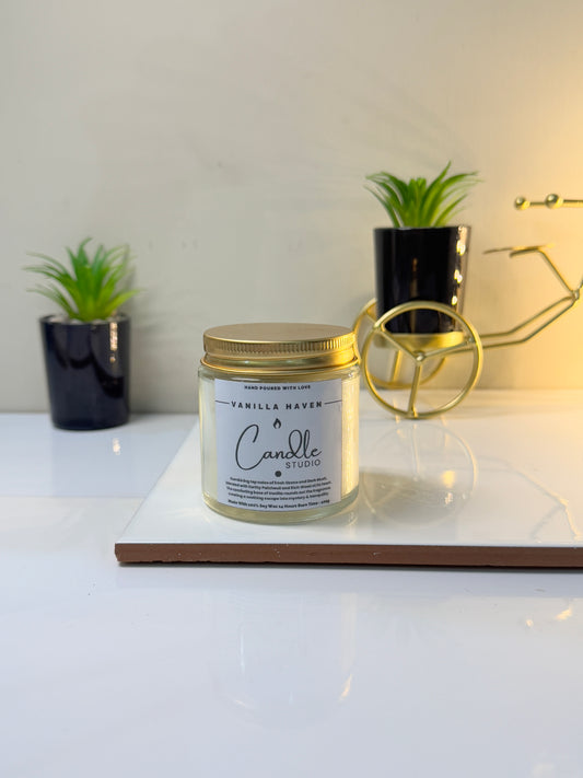 Close-up of the Vanilla Haven candle jar, highlighting its minimalist style and creamy wax.