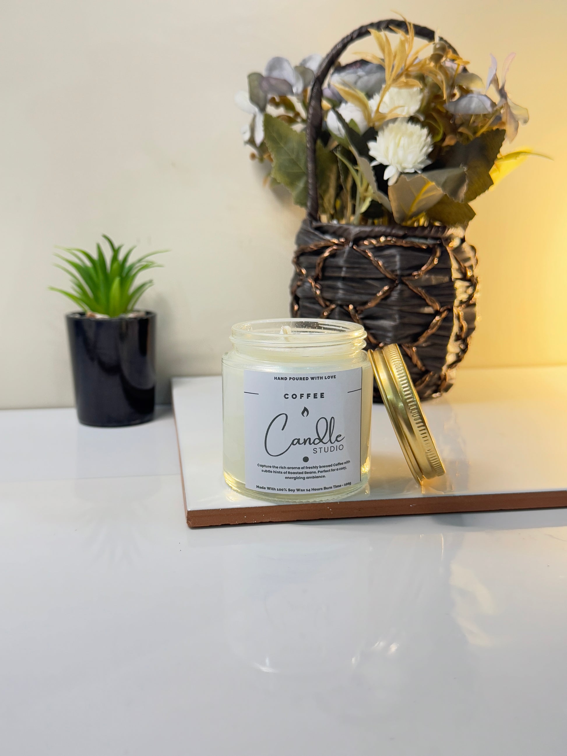 Coffee candle placed on a rustic table, creating a cozy and inviting atmosphere.