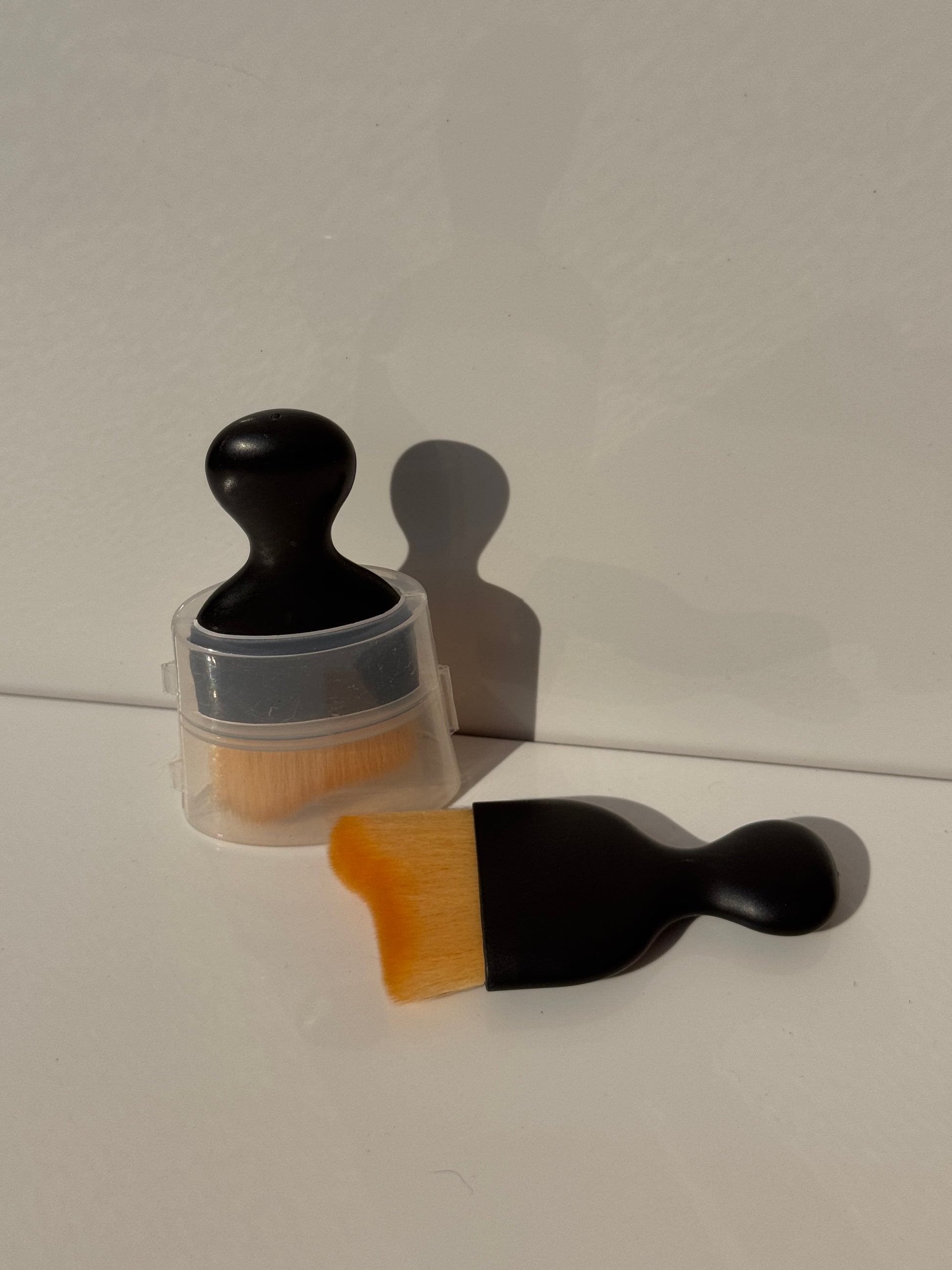 Compact and ergonomic Car Interior Dust Cleaning Soft Brush displayed alongside a clean car console.
