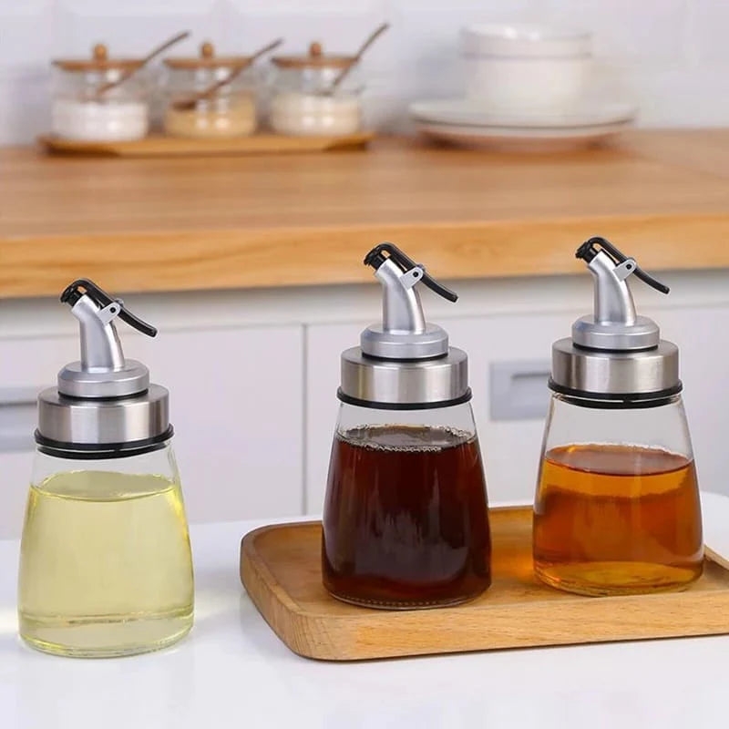 image of Oil Dispenser Bottle - Cooking oil spray bottle in use in the kitchen by techcarhome
