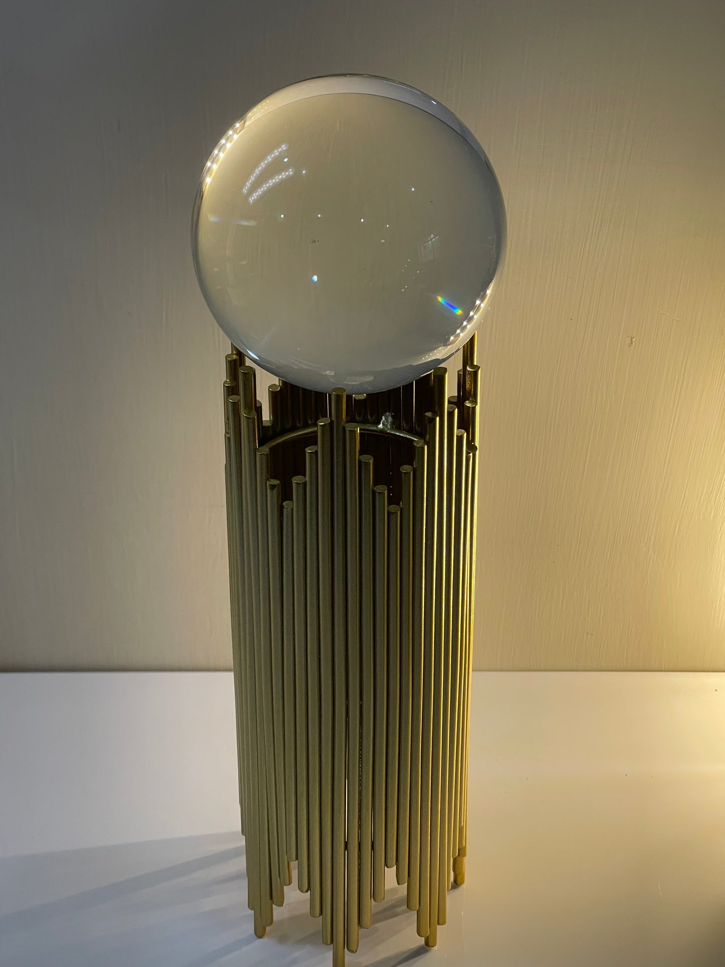 Crystal ball displayed on the Nordic sphere holder, enhancing its elegant appeal.