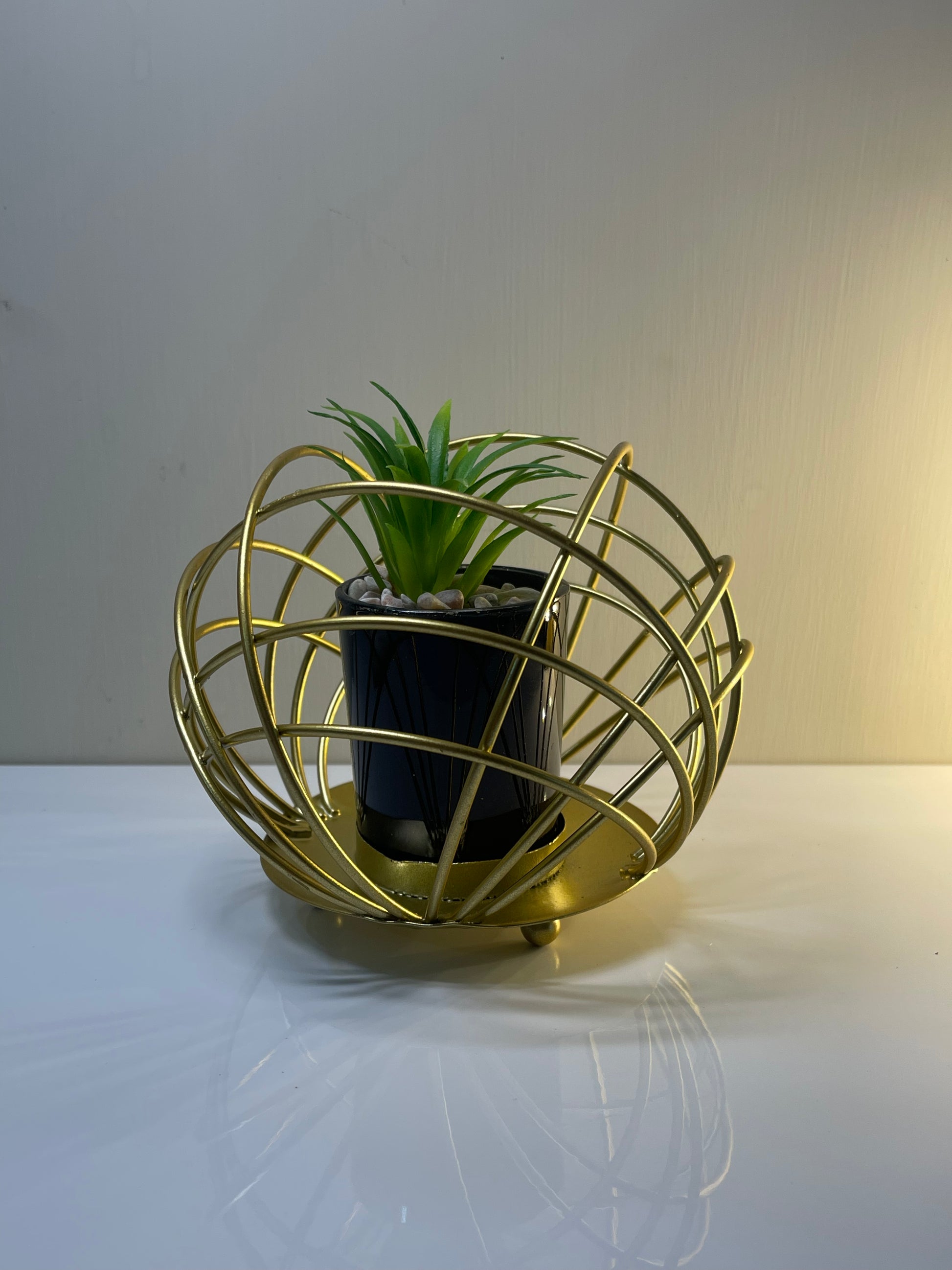 Decorative metal cactus pot stand with a stylish and elegant design.