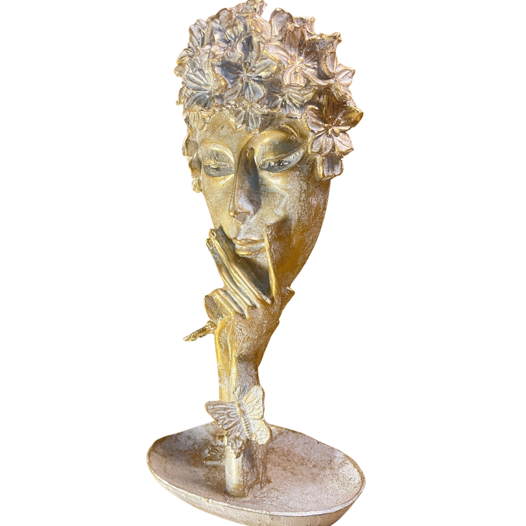Elegant Abstract Women Face Art Sculpture placed on a wooden bookshelf, surrounded by books and small decorative items.