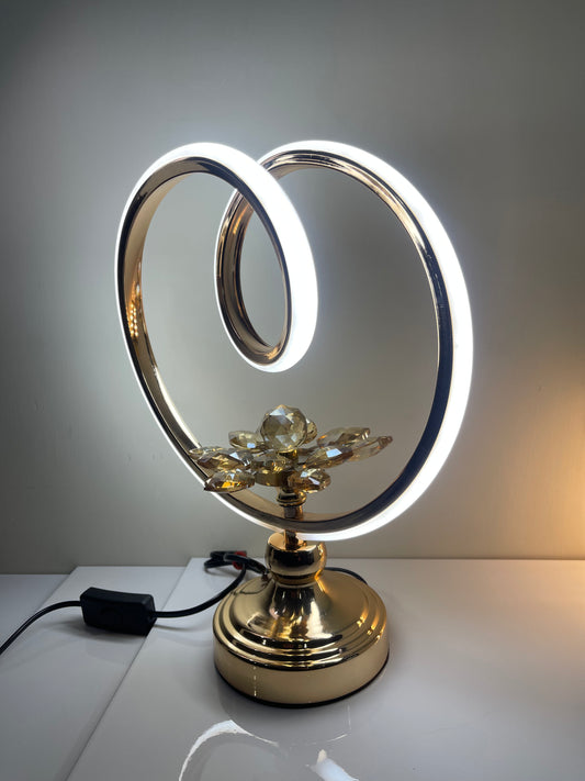 Elegant circle lamp with a flower base, showcasing its modern design and artistic details.