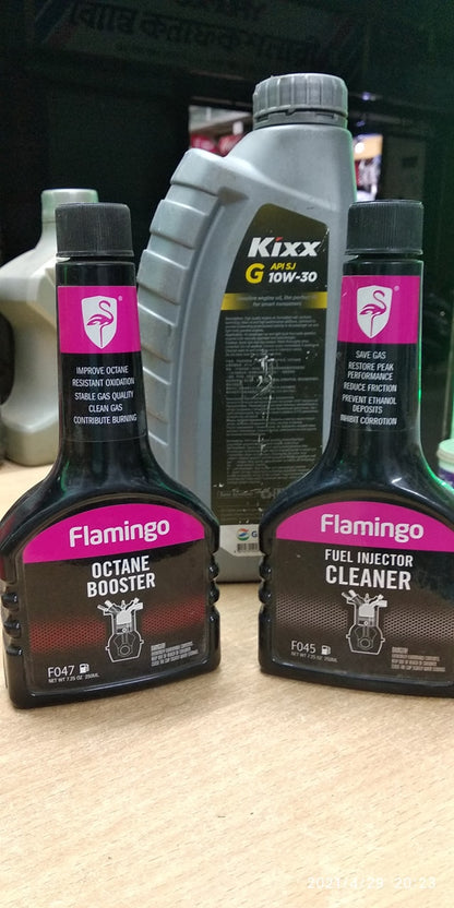 Flamingo Octane Booster displayed alongside gasoline for enhanced fuel quality – by TechCarHome.com.
