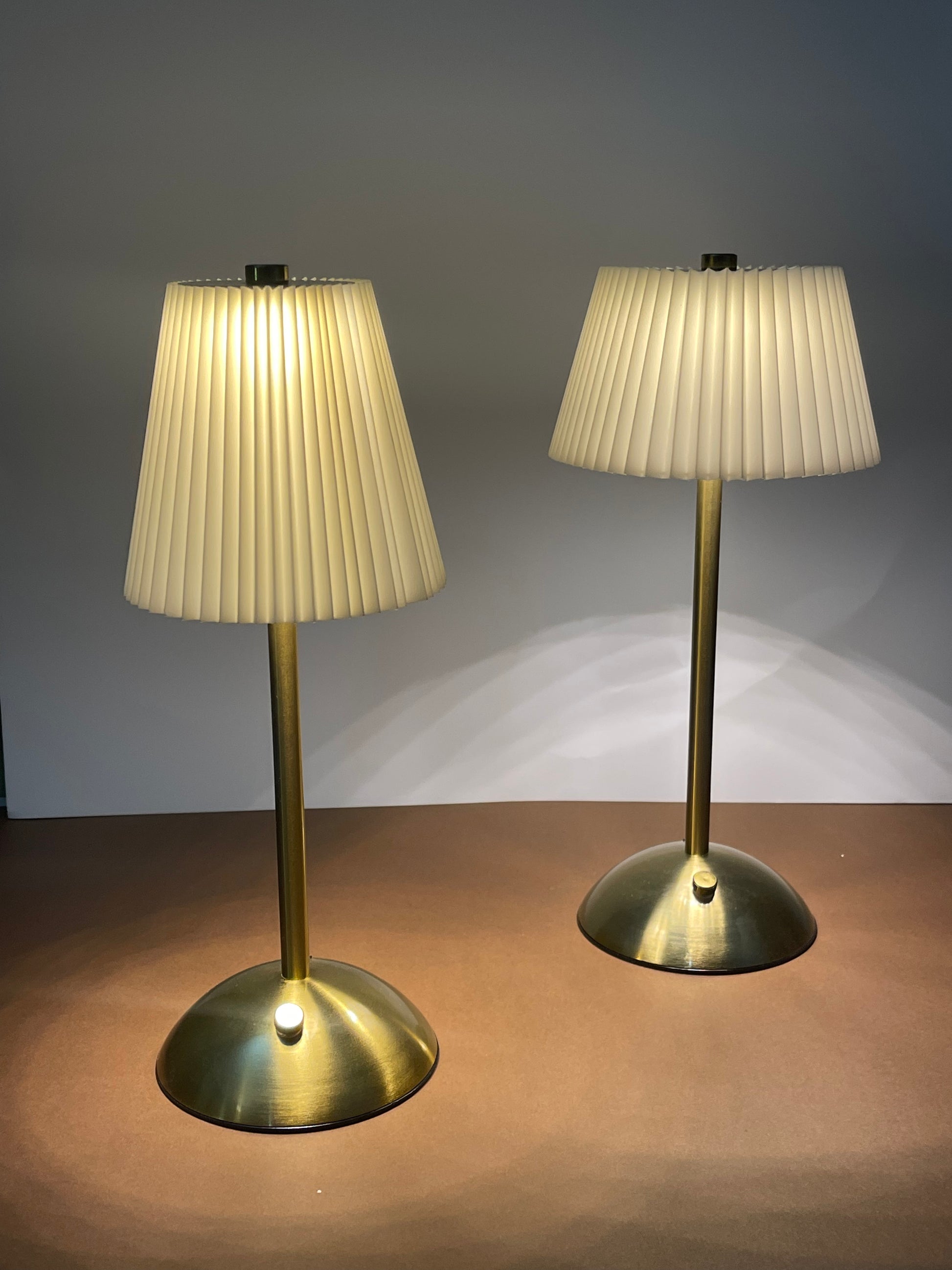 Luxury decorative table lamp with a pleated white lampshade, ideal for contemporary interiors.