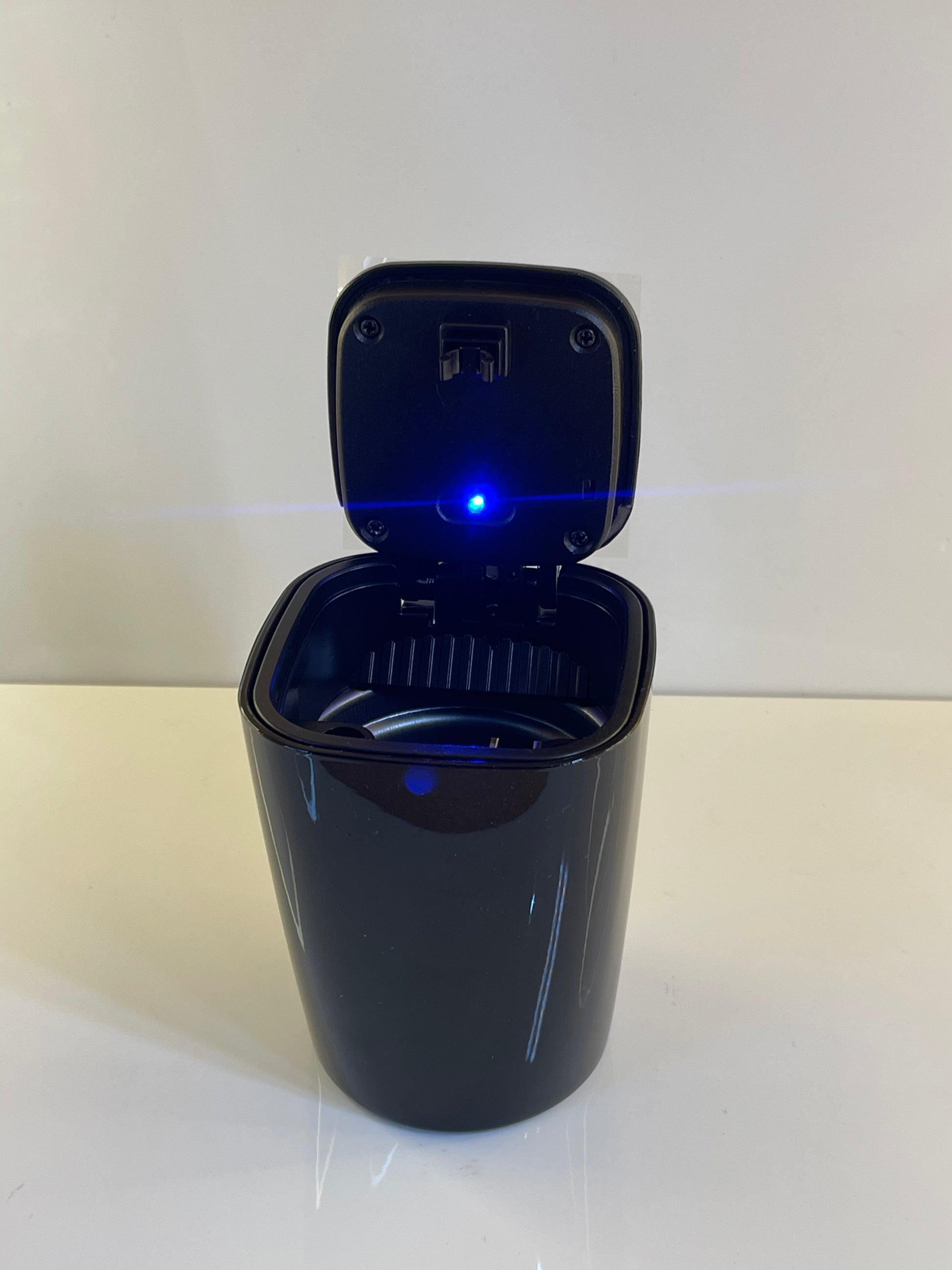 Portable Car Ashtray with compact design placed in a car cup holder – by TechCarHome.com.