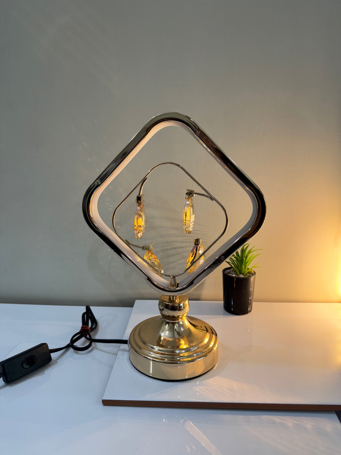 Radiant crystal square lamp displayed on a side table, adding elegance to the room.