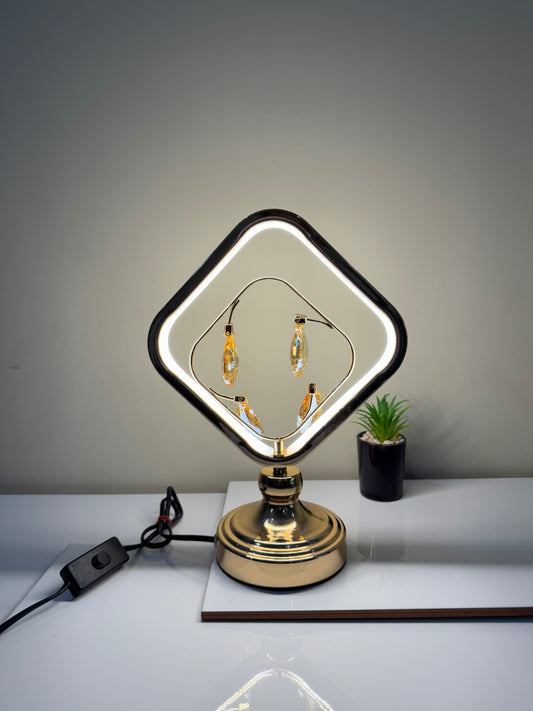 Radiant crystal square lamp with dangling gems, showcasing its modern and elegant design.
