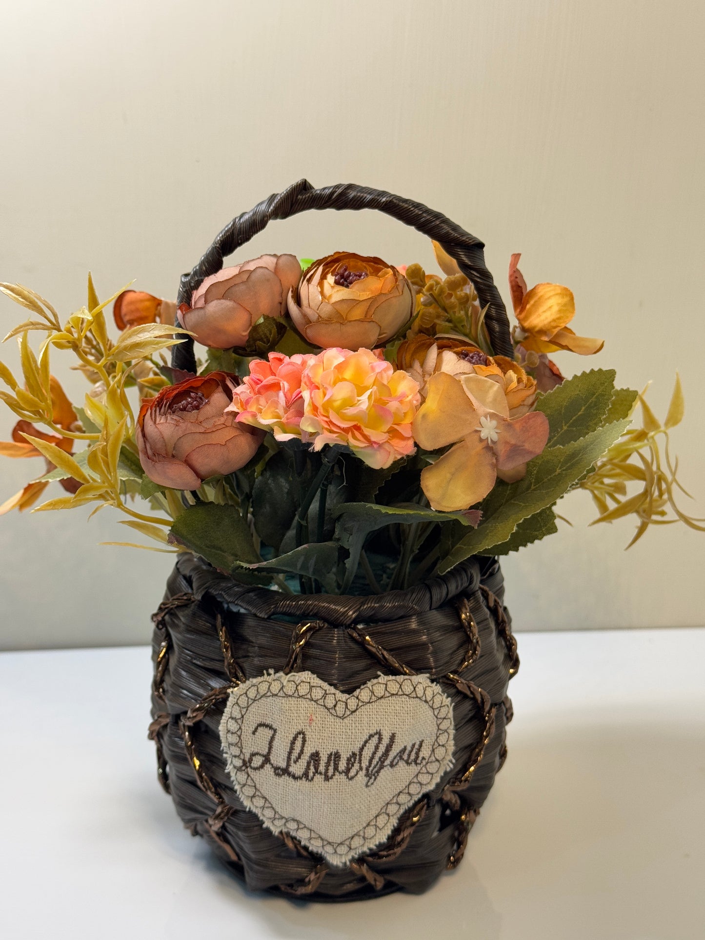 Side view of the cute flower basket with a small round design, perfect for smaller spaces.
