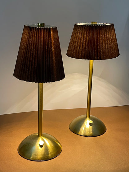 Sophisticated gold table lamp with a vintage-inspired pleated shade, perfect for luxury interiors.