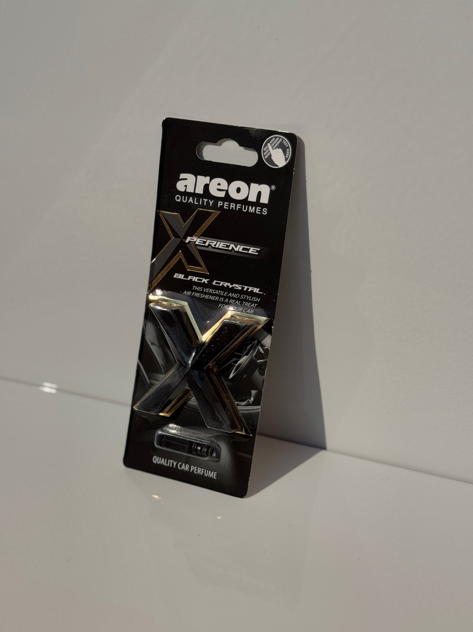 Sophisticated packaging of AREON X-perience Air Freshener Card in 'Black Crystal' scent.