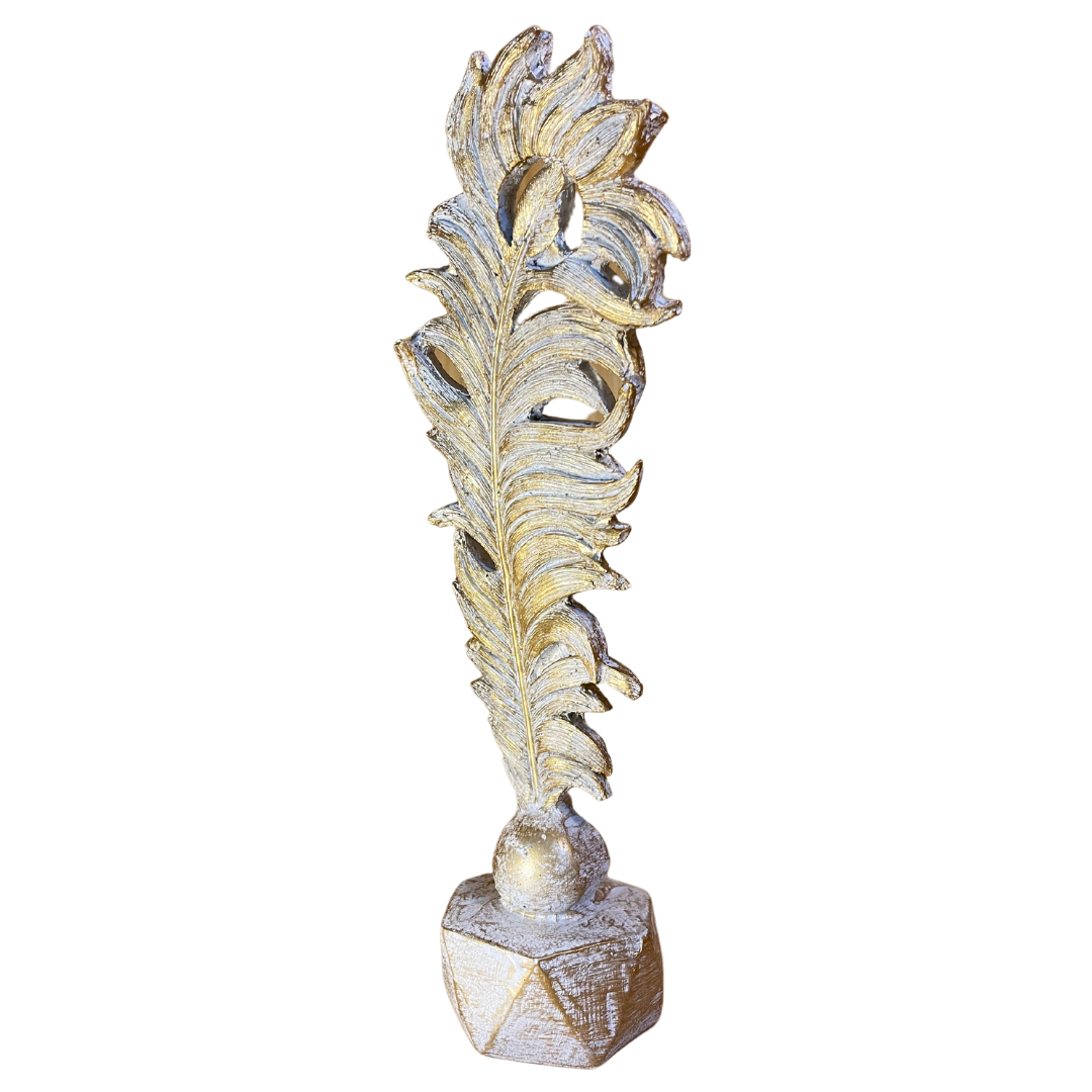 The Resin Feather Statue positioned as a centerpiece on a modern coffee table.