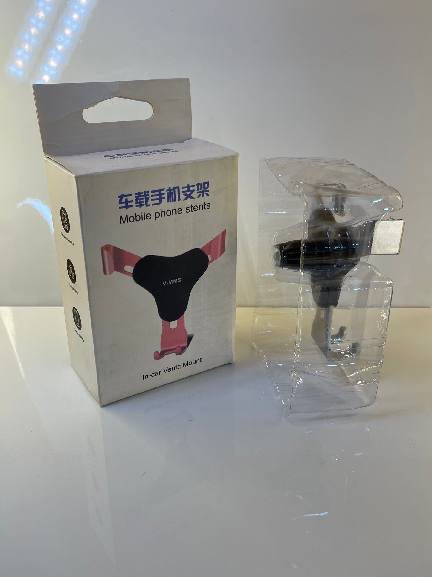 Universal Gravity Car Holder displaying compatibility with various phone sizes – by TechCarHome.com.