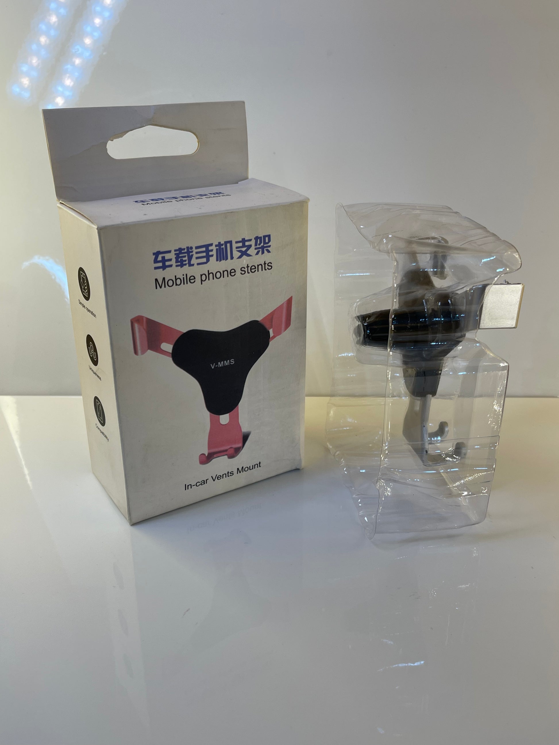 Universal Gravity Car Holder displaying compatibility with various phone sizes – by TechCarHome.com.