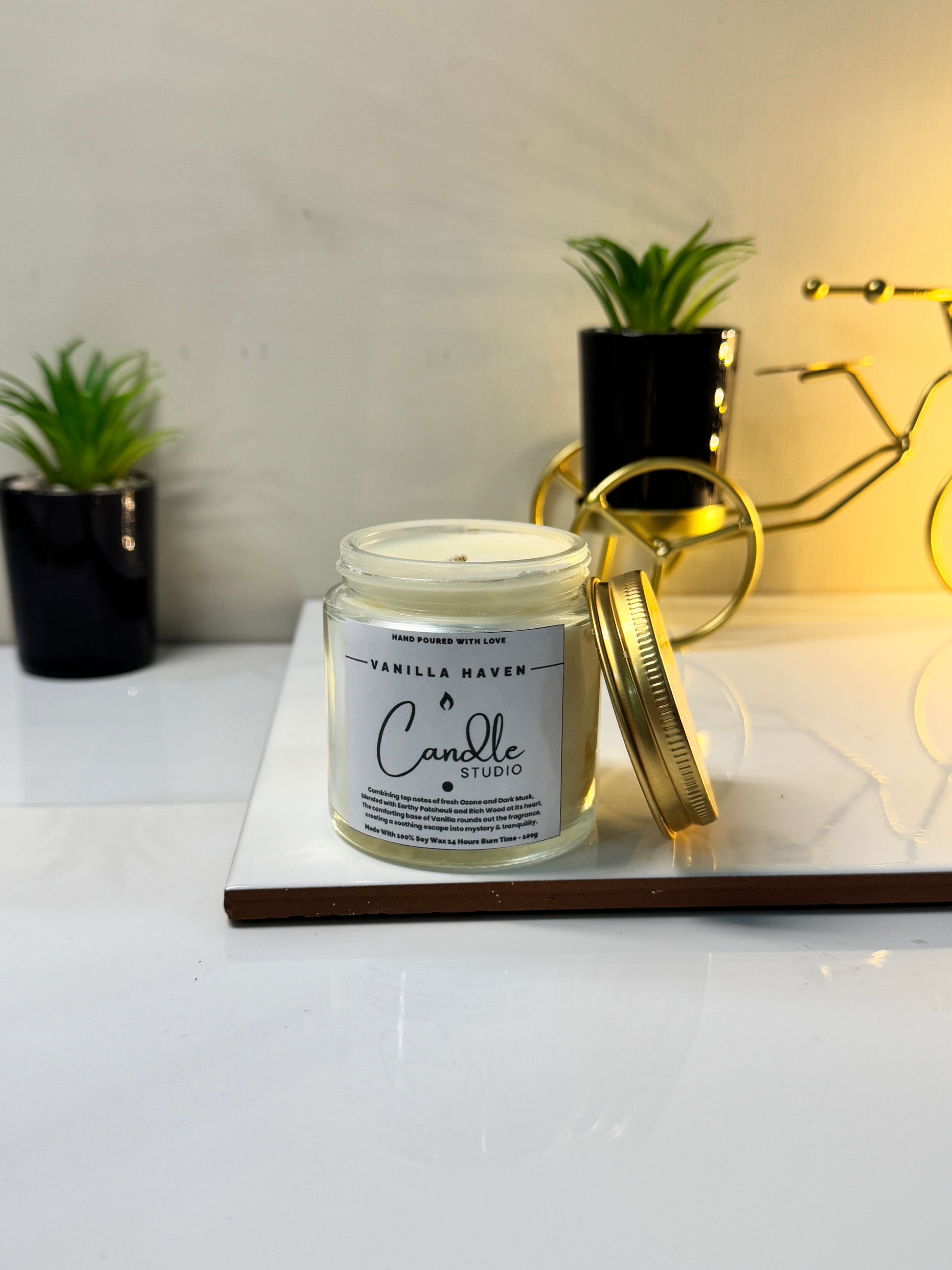 Vanilla Haven candle in a sleek jar, showcasing its elegant design and inviting vanilla fragrance