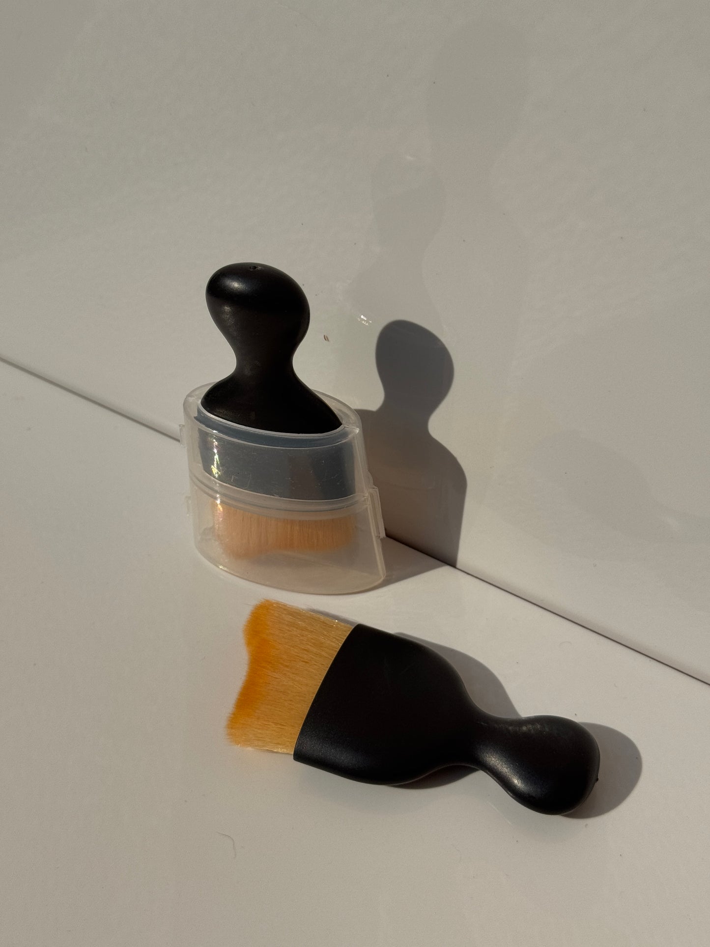Versatile cleaning brush gently removing dirt from household blinds and tight spaces.