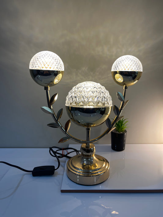 Wavy Stand Crystal Ball Lamp with three crystal balls and leaf detailing, adding elegance and charm to any space.