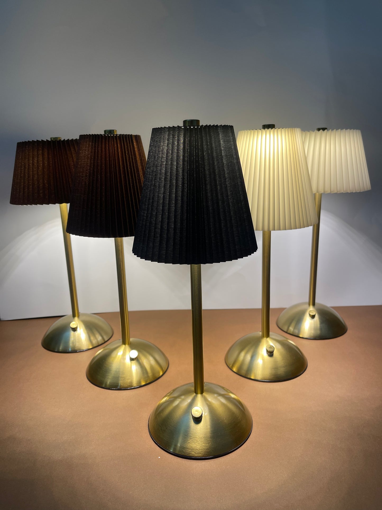 White Shade Lamp: A sleek, modern table lamp with a white shade, ideal for brightening up any room with its minimalist design.