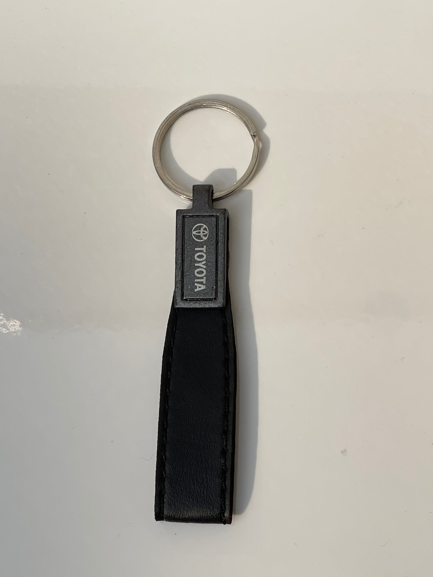 image of keychain with logo on toyota premium quality in black color by techcarhome