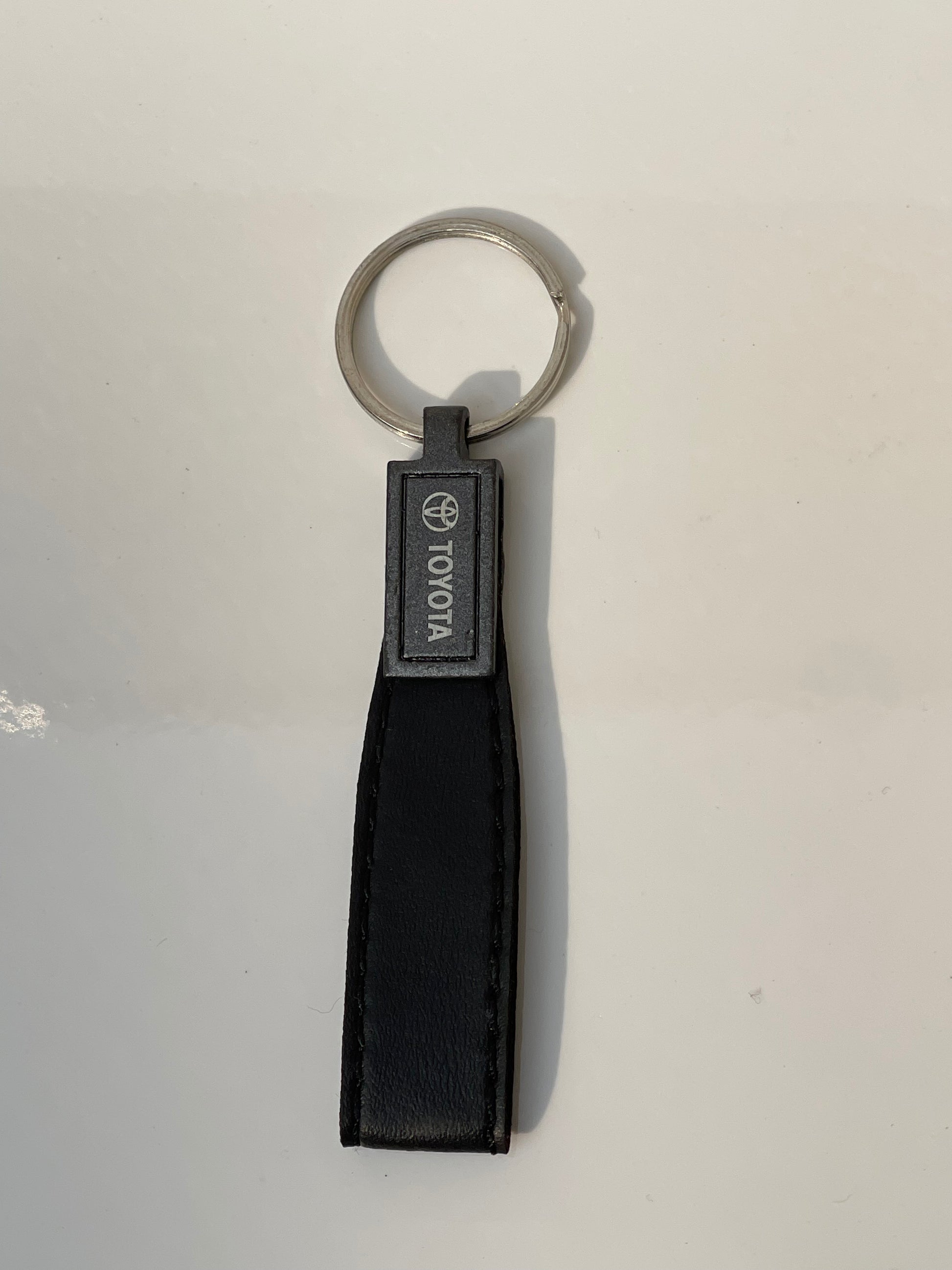 image of keychain with logo on toyota premium quality in black color by techcarhome