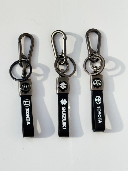 Double logo premium keychains for Honda, Toyota, and Suzuki – high-quality car accessories designed for durability and style.