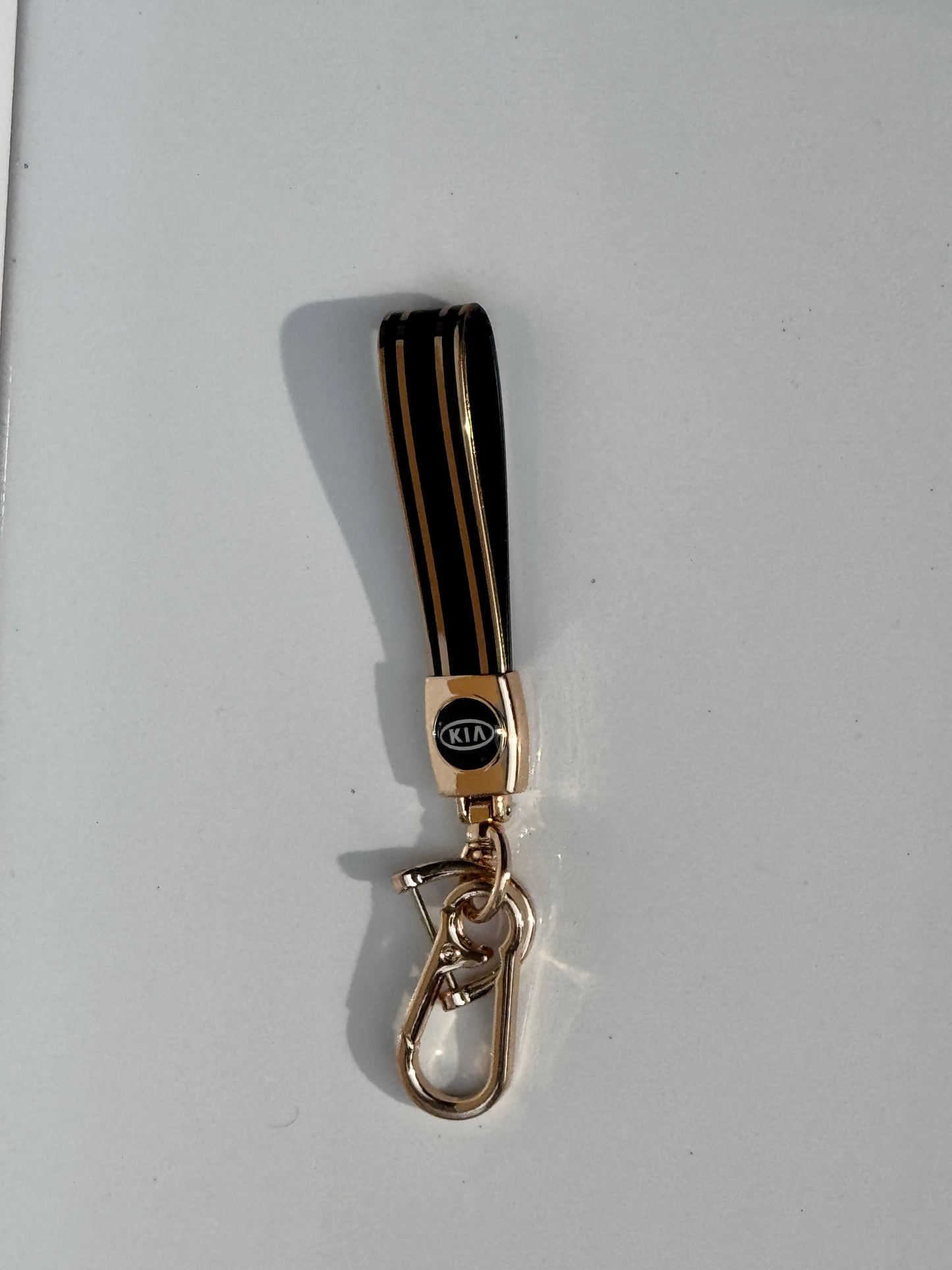 image of KIA logo car keychain premium quality in golden color 