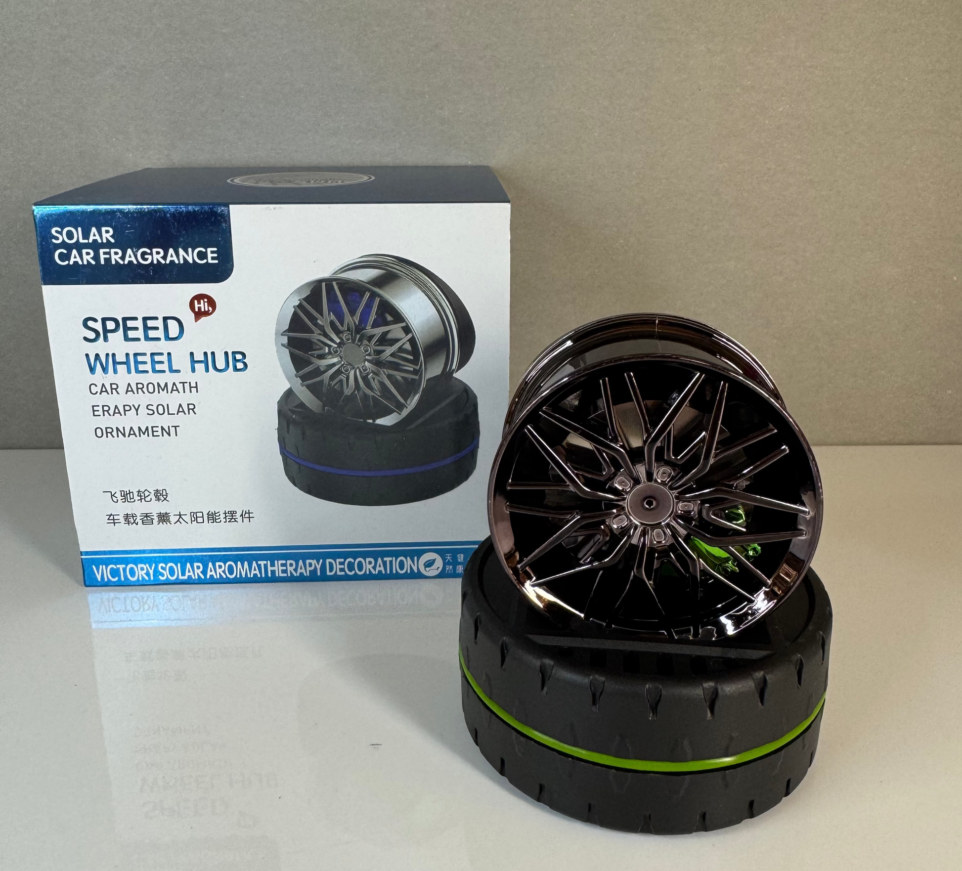 Solar car fragrance wheel hub with packaging on a neutral background